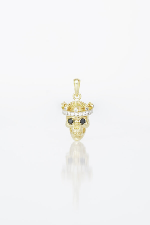 Dije Skull en oro amarillo / Peso: 8,9 / Ancho: 20 mm / Alto: 30 mm