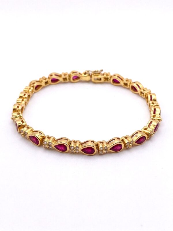 H181 BRAZALETE EN ORO AMARILLO CON RUBÍES Y DIAMANTES
